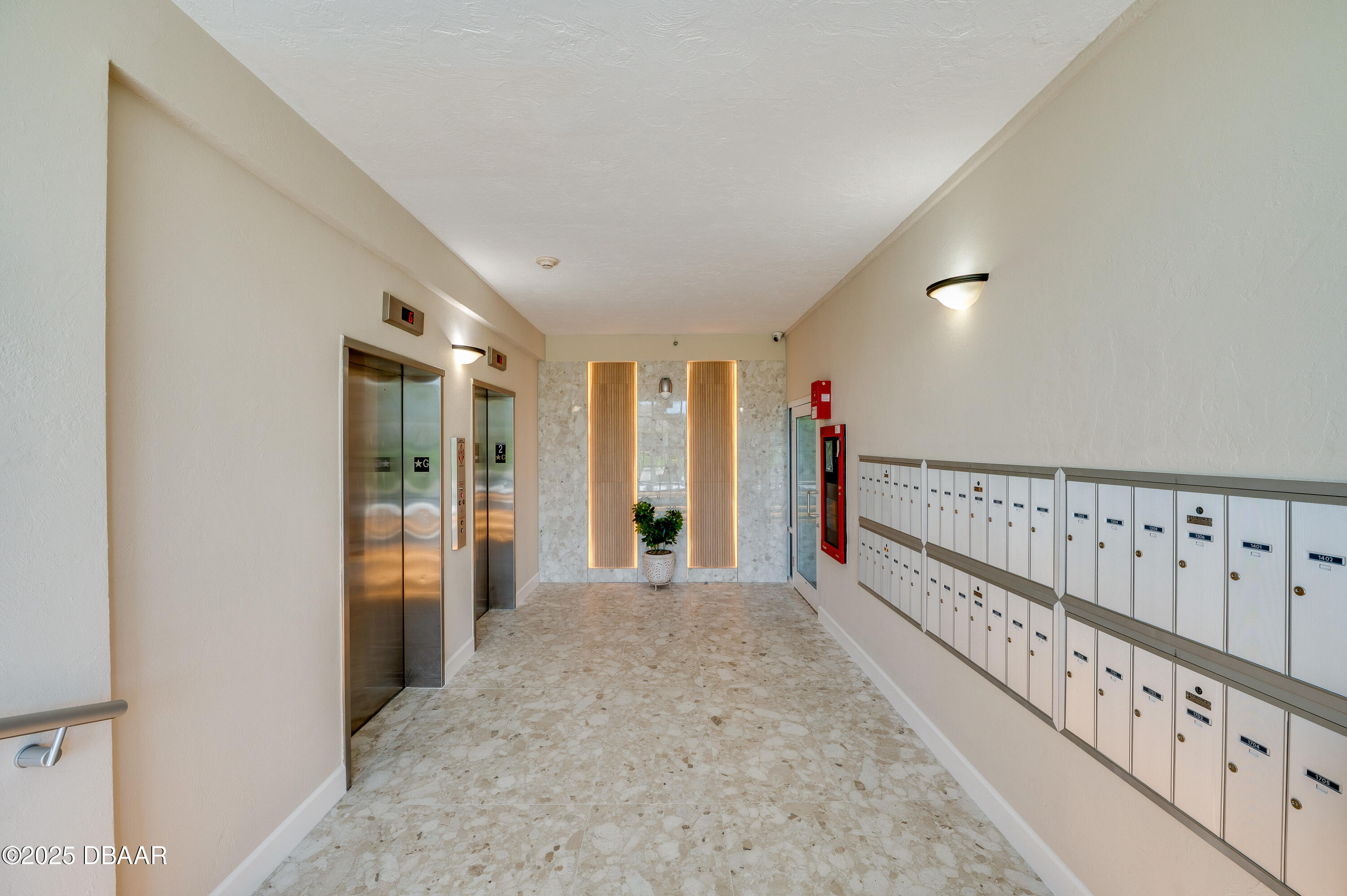 4525 South Atlantic Avenue, Unit 1704 Ponce Inlet, FL 32127 - Photo 41 of 45 a view of an entryway with wooden floor