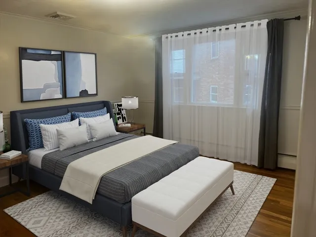 a bedroom with a bed and a mirror