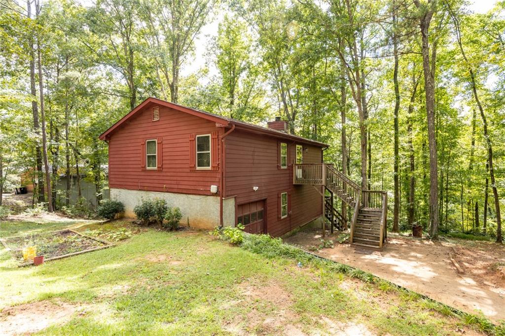 6076 Belle Meade Drive Villa Rica, GA 30180 - Photo 1 of 1 a view of a backyard of the house