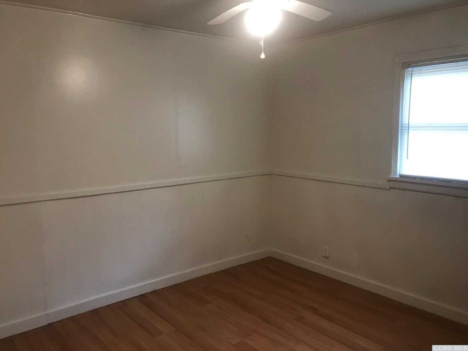 53 Lake Mills Road, Unit 11 Cairo, NY 12413 - Photo 3 of 6 a view of a small space with wooden floor and windows