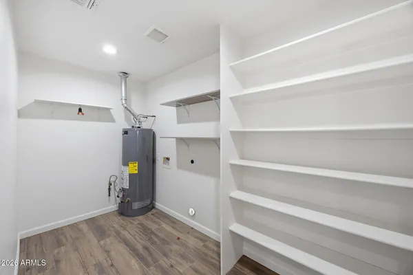 a view of storage and utility room with empty racks