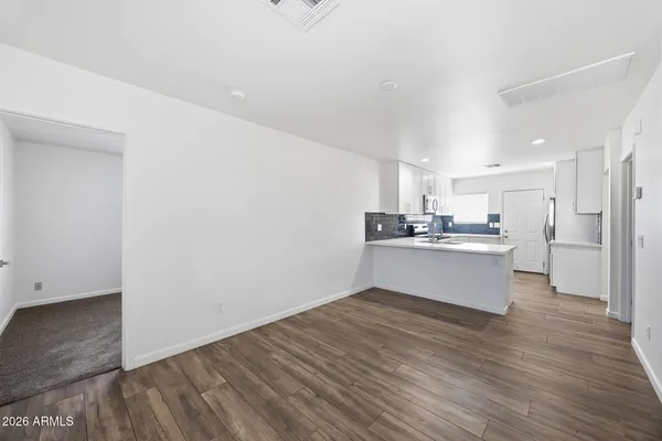 a view of kitchen with wooden floor