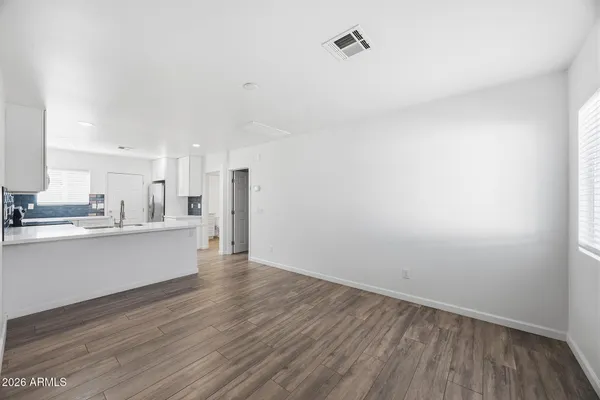a view of kitchen with wooden floor