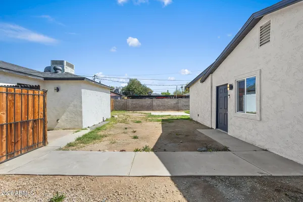 a view of a backyard of the house