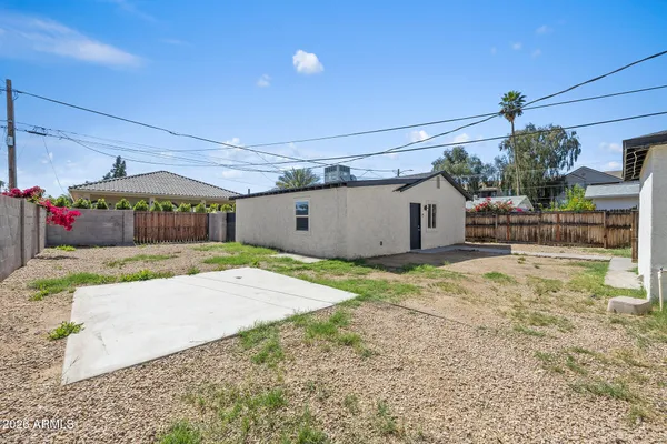 a view of a backyard of the house