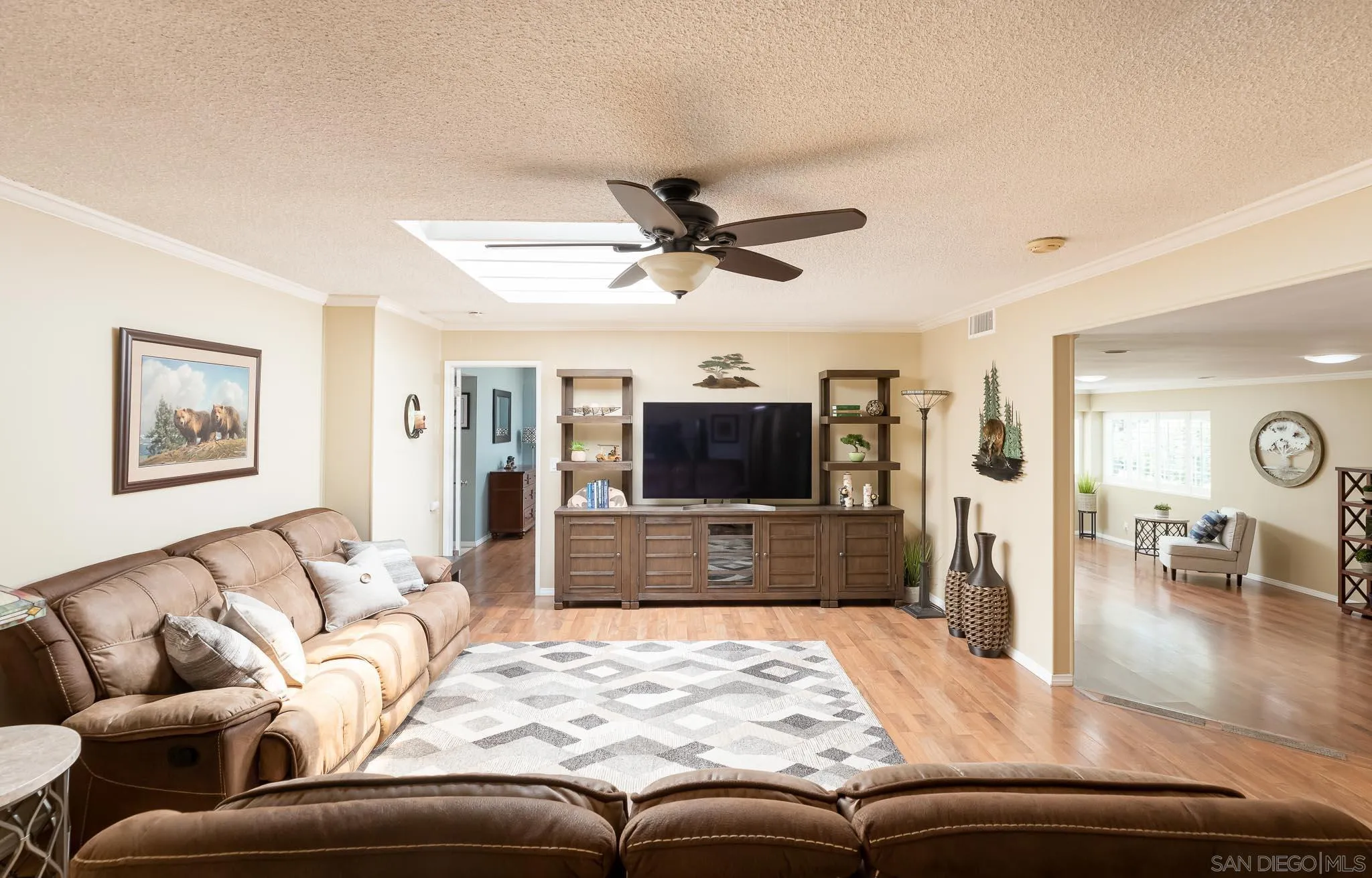 16761 Martincoit Road Poway, CA 92064 - Photo 5 of 42 a living room with furniture and a flat screen tv