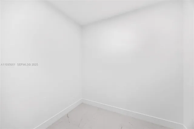 a bathroom with a sink shower and a mirror