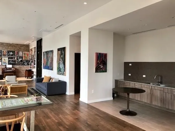 a living room with furniture and a piano