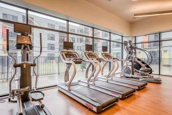 a view of a gym with gym equipment