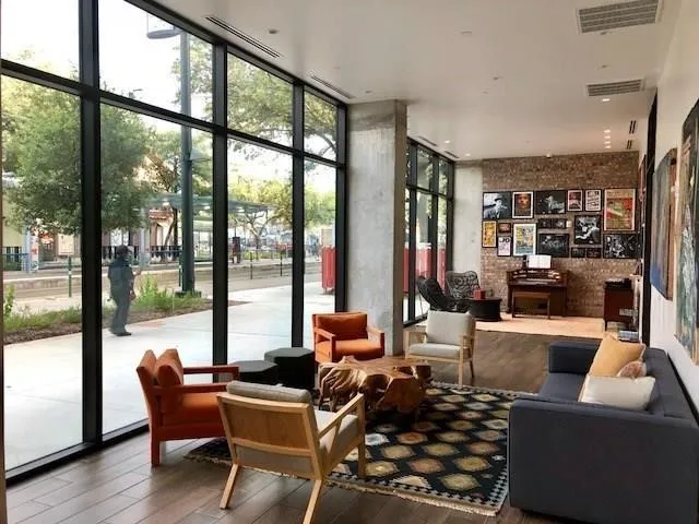 a living room with furniture and a large window