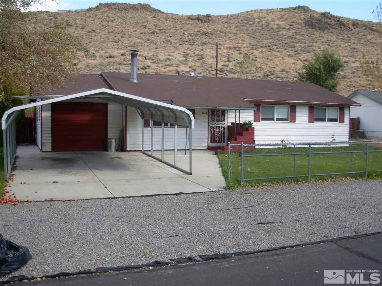 9060 Reservoir Street Reno, NV 89506 - Photo 1 of 1 a view of a house with a yard