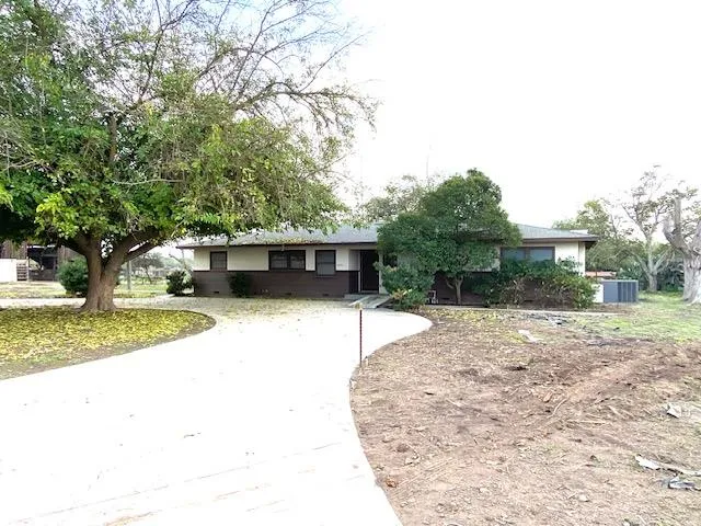 a house view with a backyard space