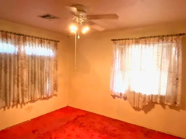 a view of an empty room and window