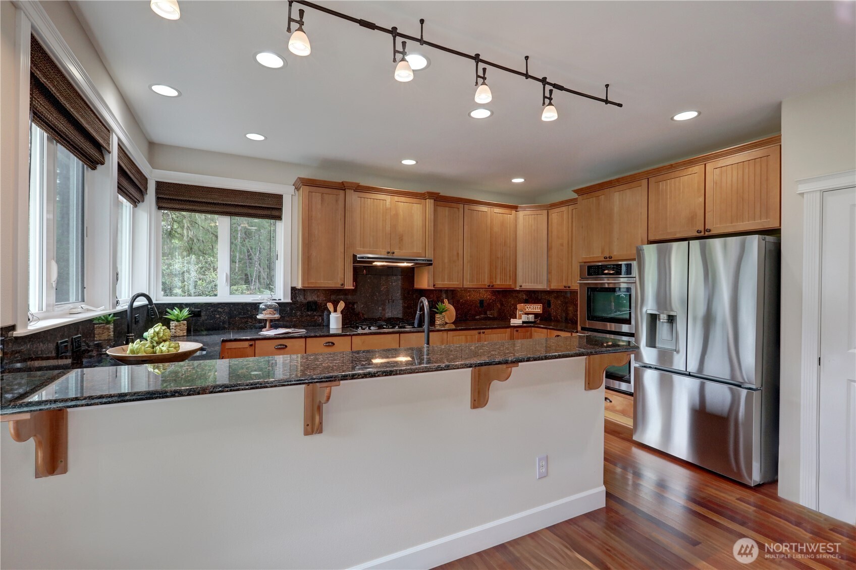 280 East Laurel Park Union, WA 98592 - Photo 13 of 39 a kitchen with stainless steel appliances granite countertop a refrigerator a sink a stove and a refrigerator with wooden floor
