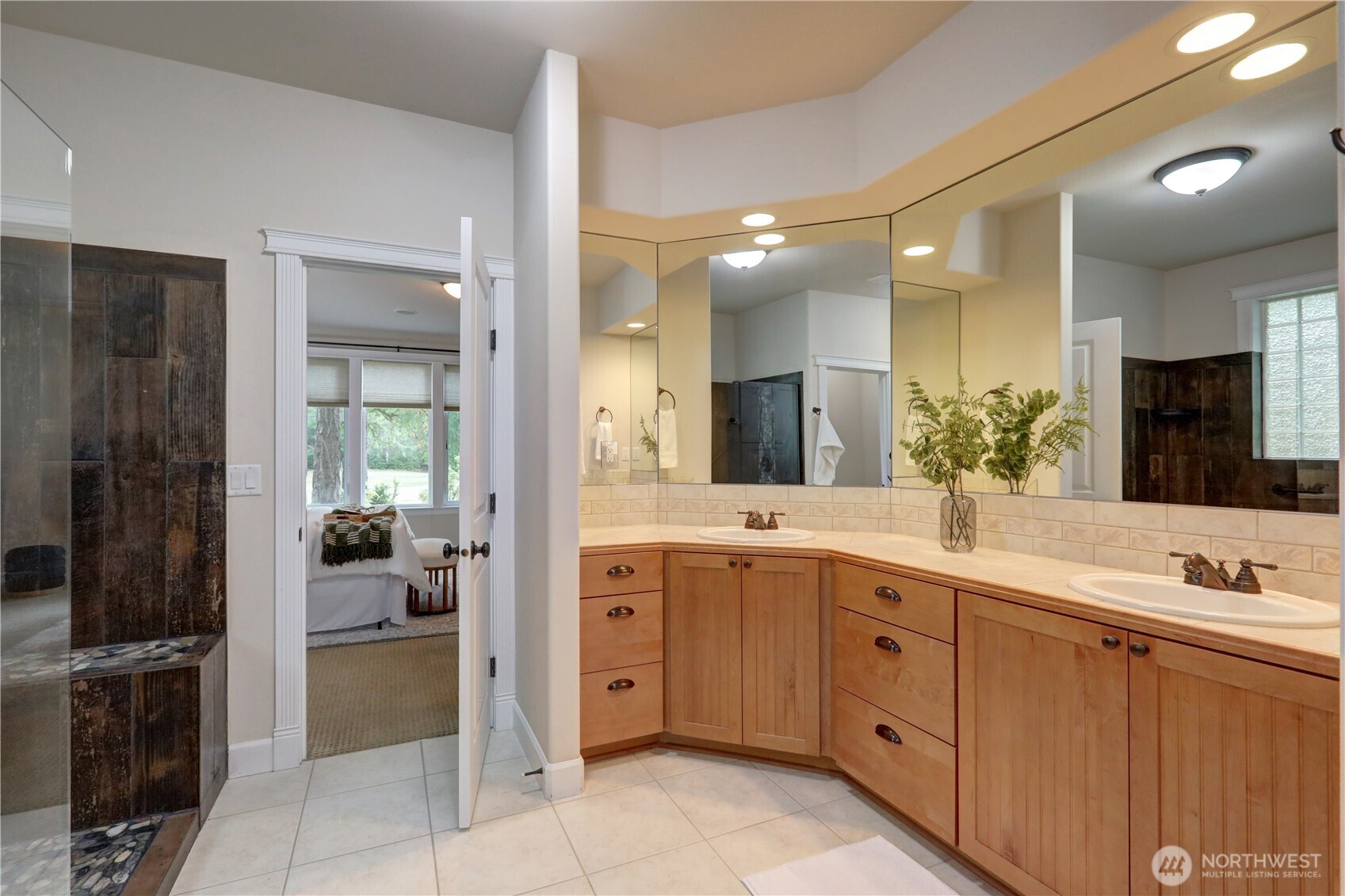 280 East Laurel Park Union, WA 98592 - Photo 19 of 39 a spacious bathroom with a double vanity sink a large mirror and a shower