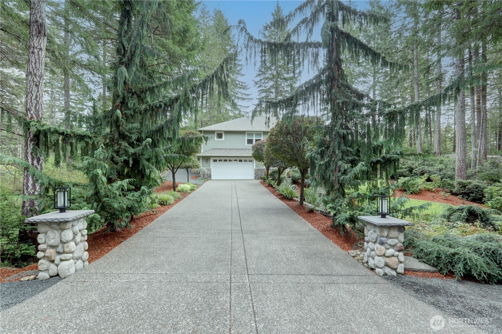 280 East Laurel Park Union, WA 98592 - Photo 3 of 39 a view of a patio with plants and a flower garden