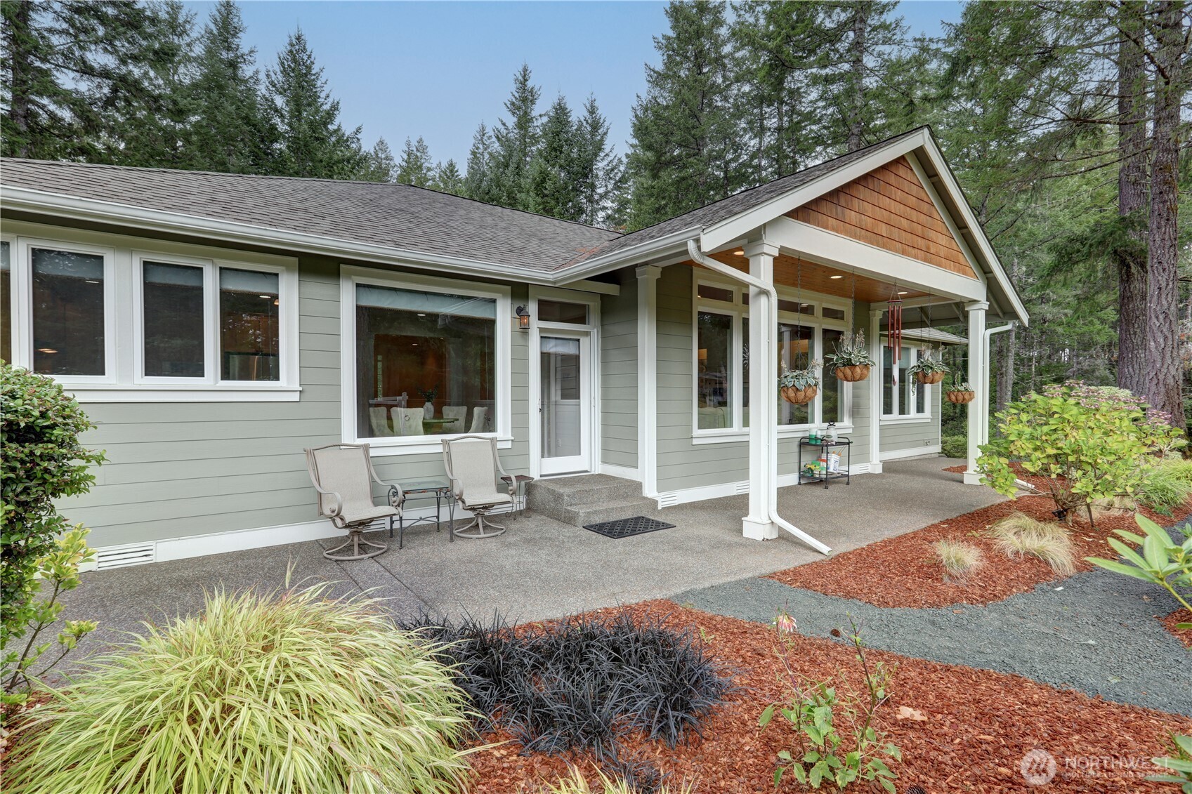 280 East Laurel Park Union, WA 98592 - Photo 6 of 39 a front view of a house with a garden and porch