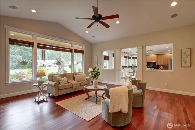 a living room with fireplace furniture and a wooden floor
