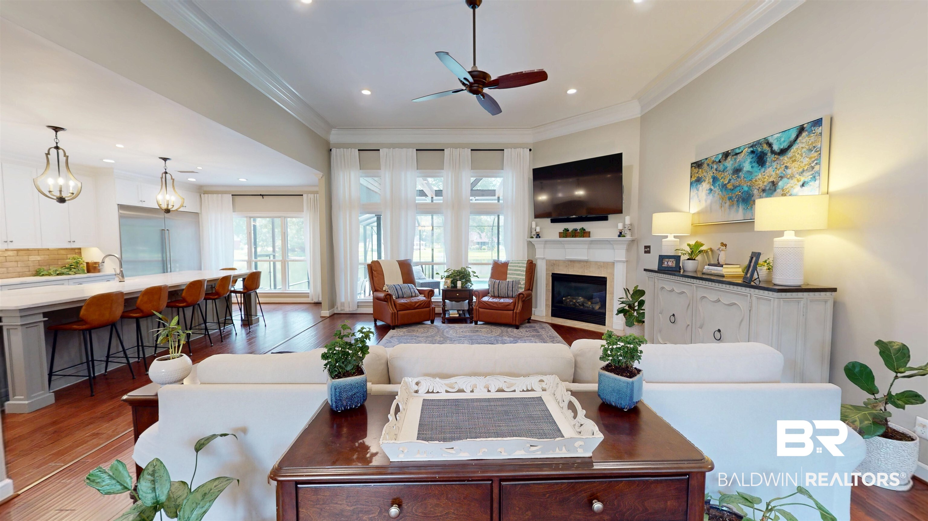 8775 Dawes Lake Road North Mobile, AL 36619 - Photo 24 of 59 Living room featuring wood finished floors, ornamental molding, a glass covered fireplace, a ceiling fan, and recessed lighting