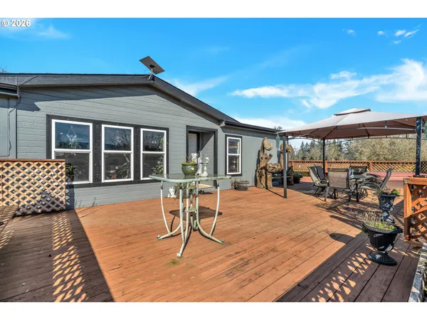 a view of a terrace with furniture and stove