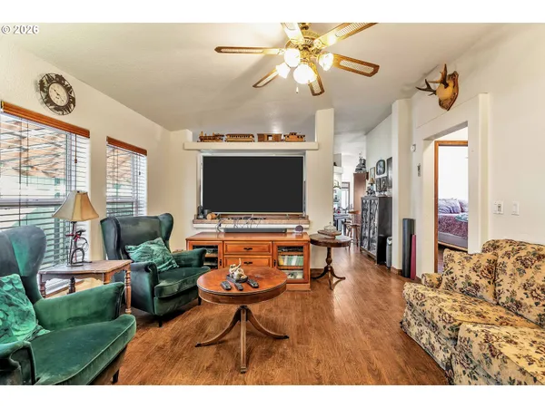 a large kitchen with stainless steel appliances a lot of counter space and a window