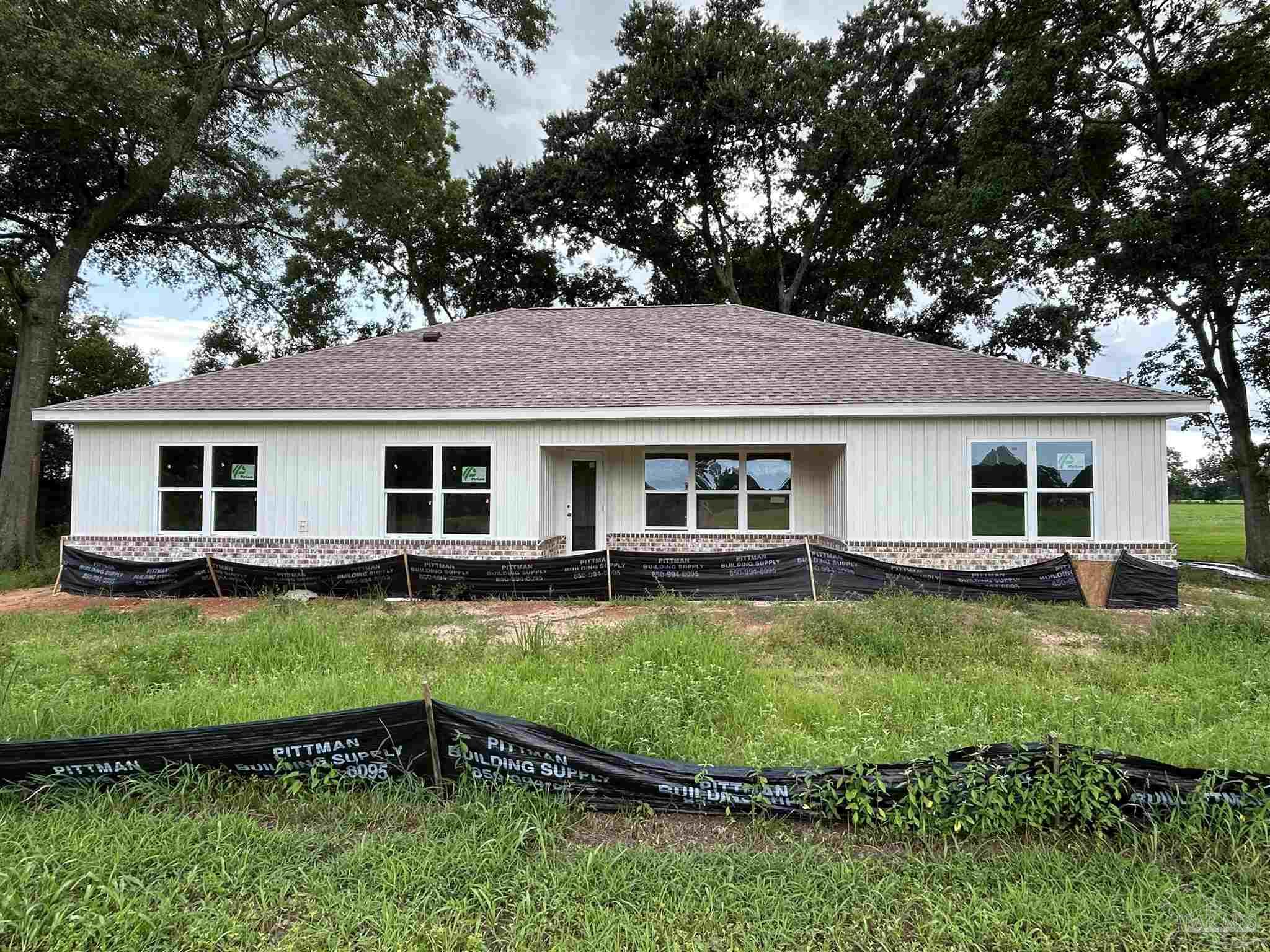 4954 Beck Avenue Jay, FL 32565 - Photo 3 of 9 a view of a yard with swimming pool and sitting area