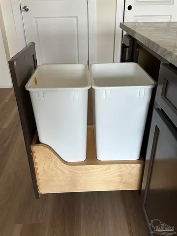 a view of a room with wooden floor and staircase
