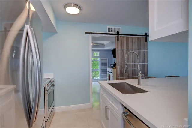 a bathroom with a sink a mirror and a shower