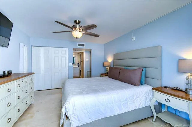 a bathroom with a double vanity sink toilet mirror and shower
