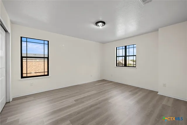 an empty room with windows