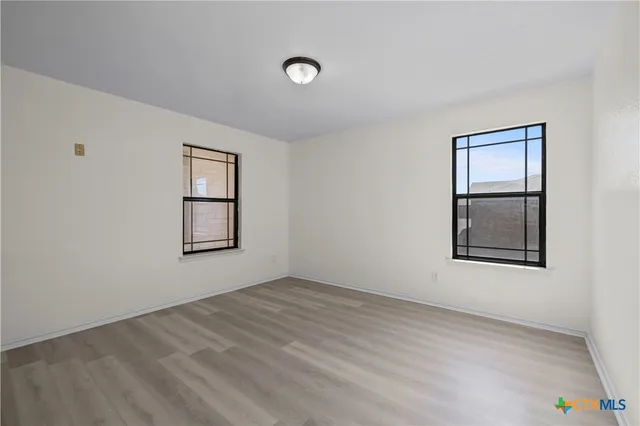 an empty room with windows