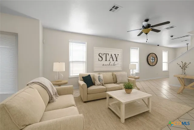 a living room with furniture and a window