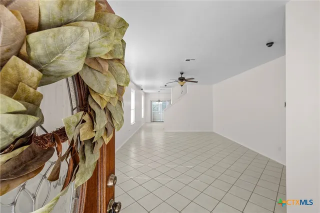 a view of an entryway with wooden floor