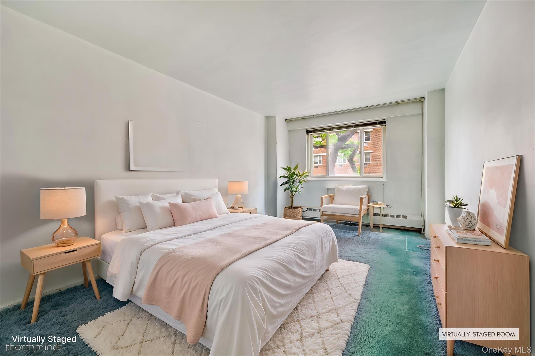 39-65 52nd Street, Unit 2H Queens, NY 11377 - Photo 3 of 18 a spacious bedroom with a bed and a couch