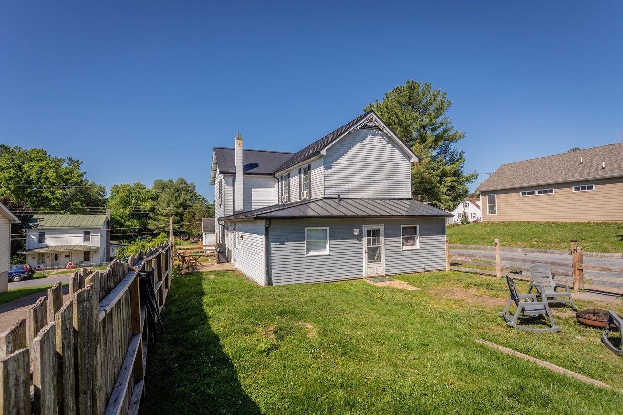 420 West Spring Street Woodstock, VA 22664 - Photo 60 of 67 a front view of a house with a yard