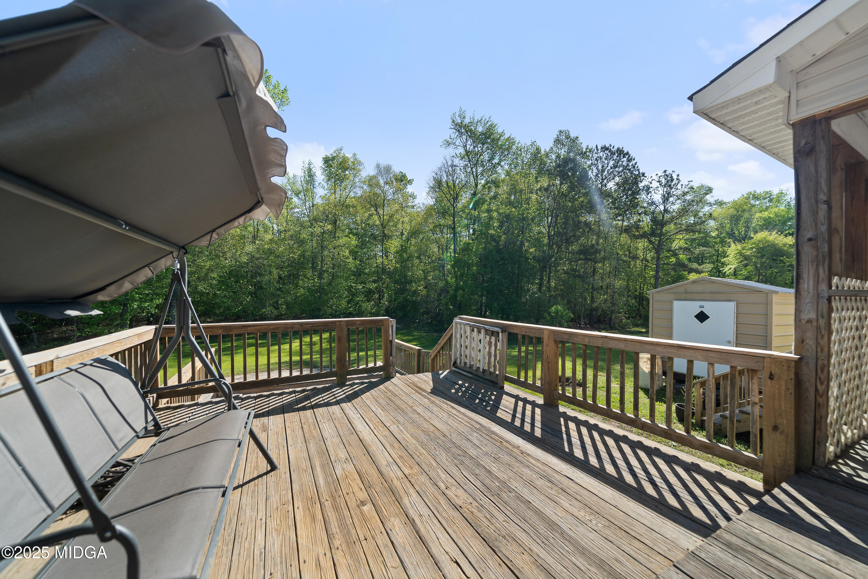192 Whitaker Road Macon, GA 31211 - Photo 26 of 30 a view of balcony with wooden floor and outdoor seating