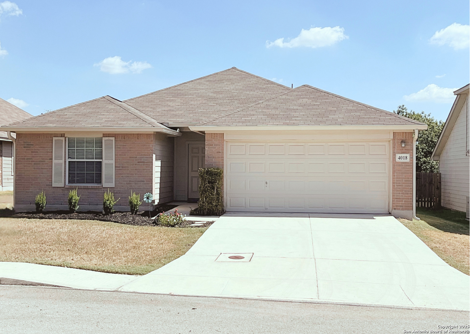 a front view of a house with yard