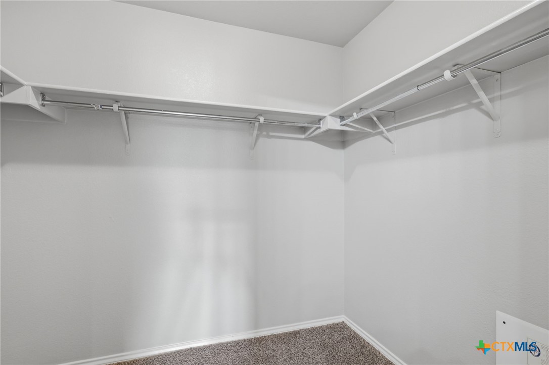 8716 Starview Street Temple, TX 76502 - Photo 21 of 36 Walk-in closet with ample wire shelving.