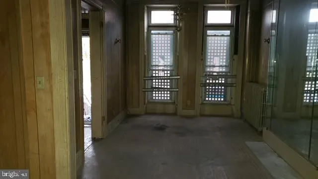 a view of empty room with windows