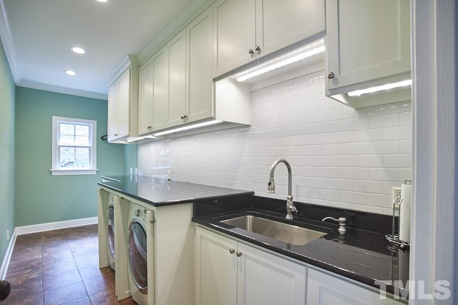 3801 Northampton Road Durham, NC 27707 - Photo 15 of 30 Everything is neat and tucked away. Could possibly pull double duty as butler's pantry. Boundless options!