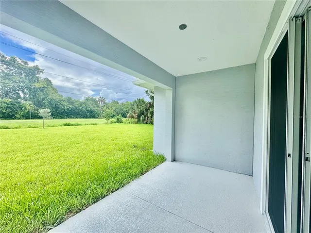 a view of open space with yard