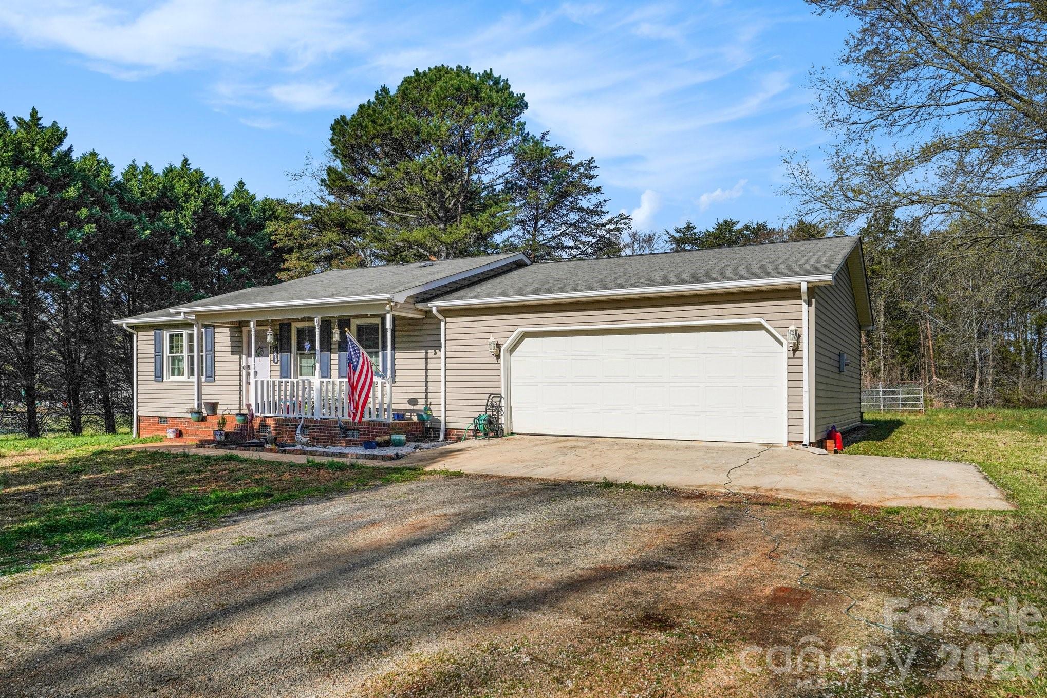 2040 Providence Church Road Salisbury, NC 28146 - Photo 2 of 14 a front view of a house with a yard and garage