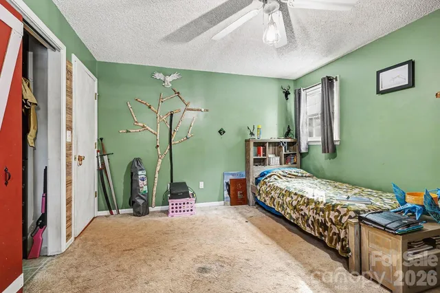 a bedroom with bed and a window