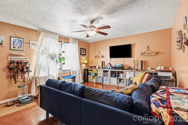 a living room with furniture and a flat screen tv