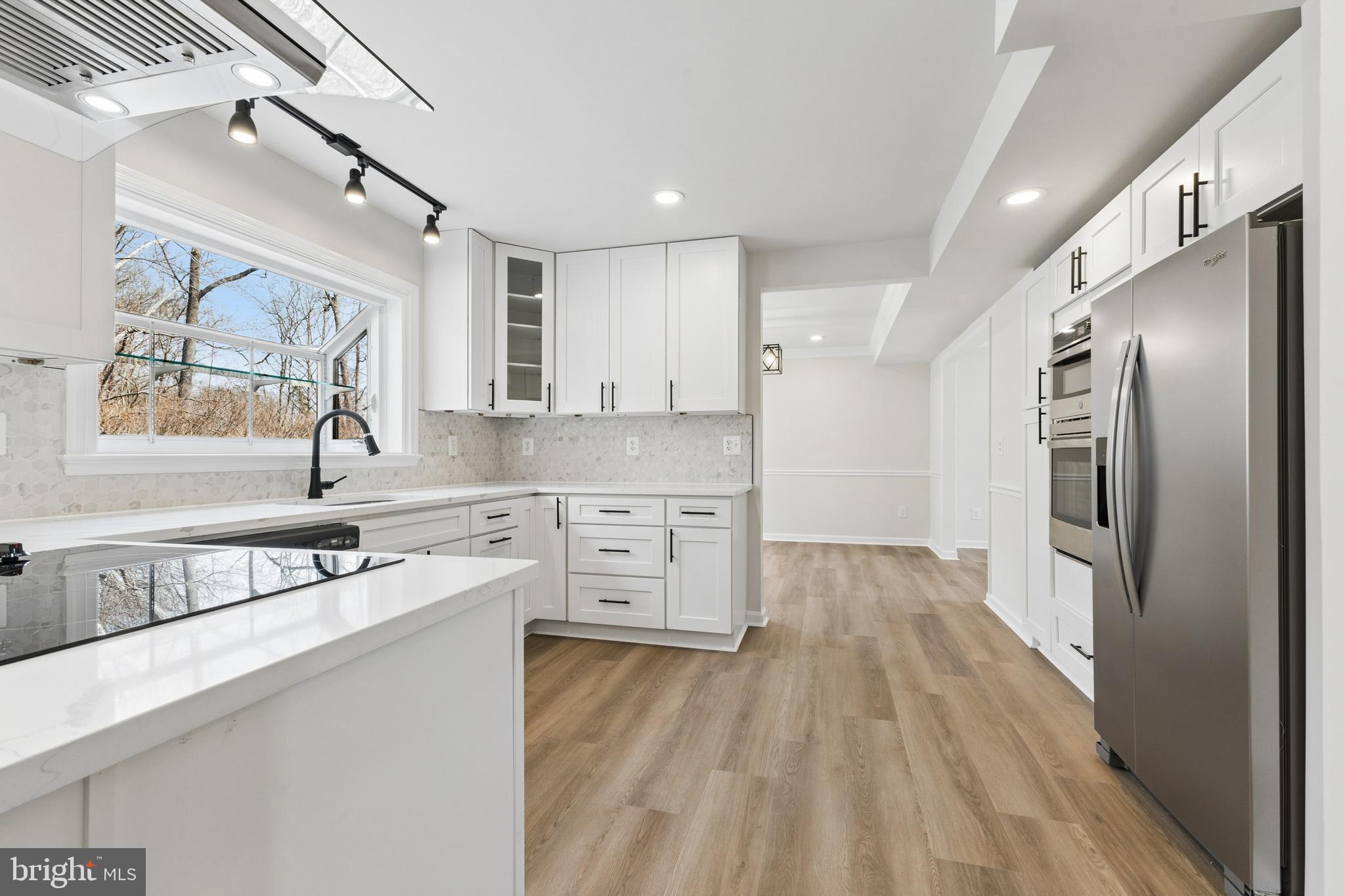 8 Lawhorn Road Stafford, VA 22554 - Photo 11 of 40 a kitchen with stainless steel appliances granite countertop a sink stove and refrigerator
