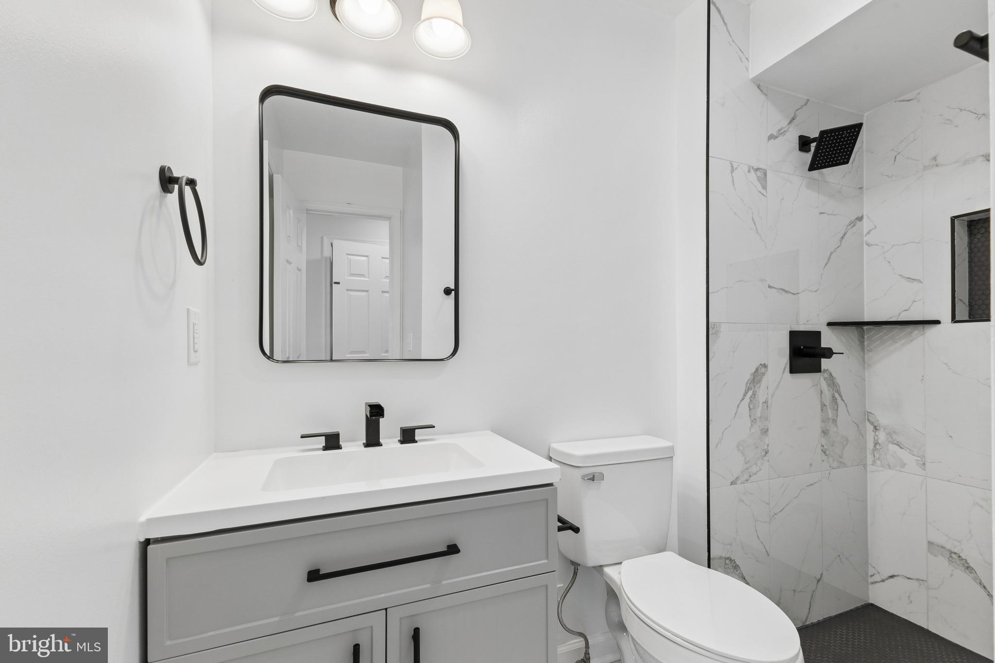 8 Lawhorn Road Stafford, VA 22554 - Photo 20 of 40 a bathroom with a sink toilet and shower