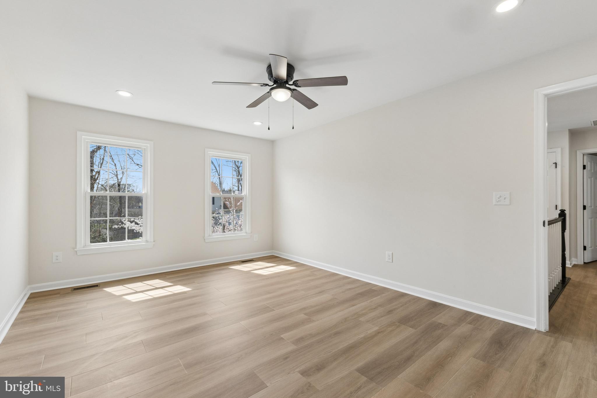 8 Lawhorn Road Stafford, VA 22554 - Photo 32 of 40 a view of an empty room with a window and wooden floor