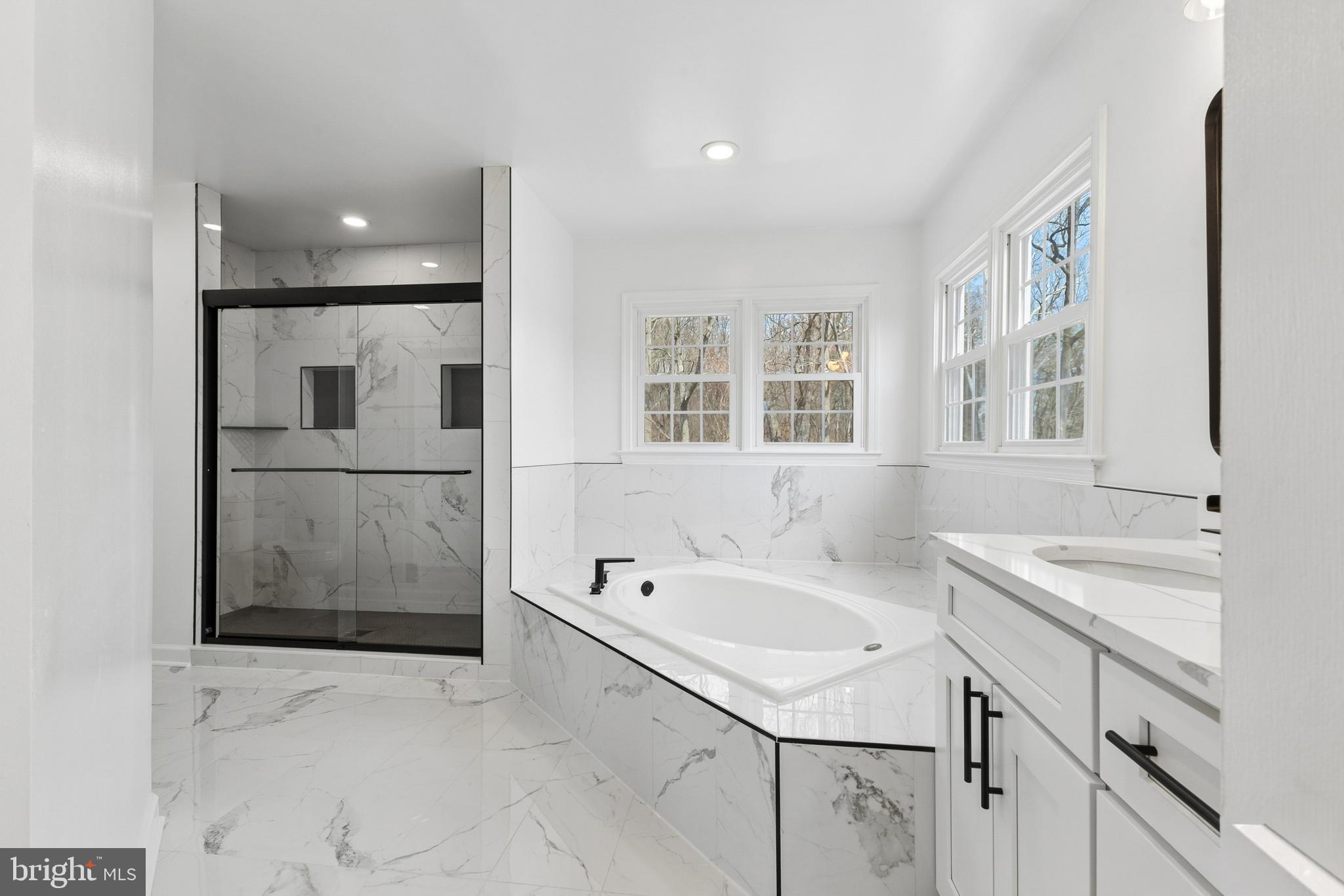 8 Lawhorn Road Stafford, VA 22554 - Photo 33 of 40 a bathroom with a sink a bathtub and a shower