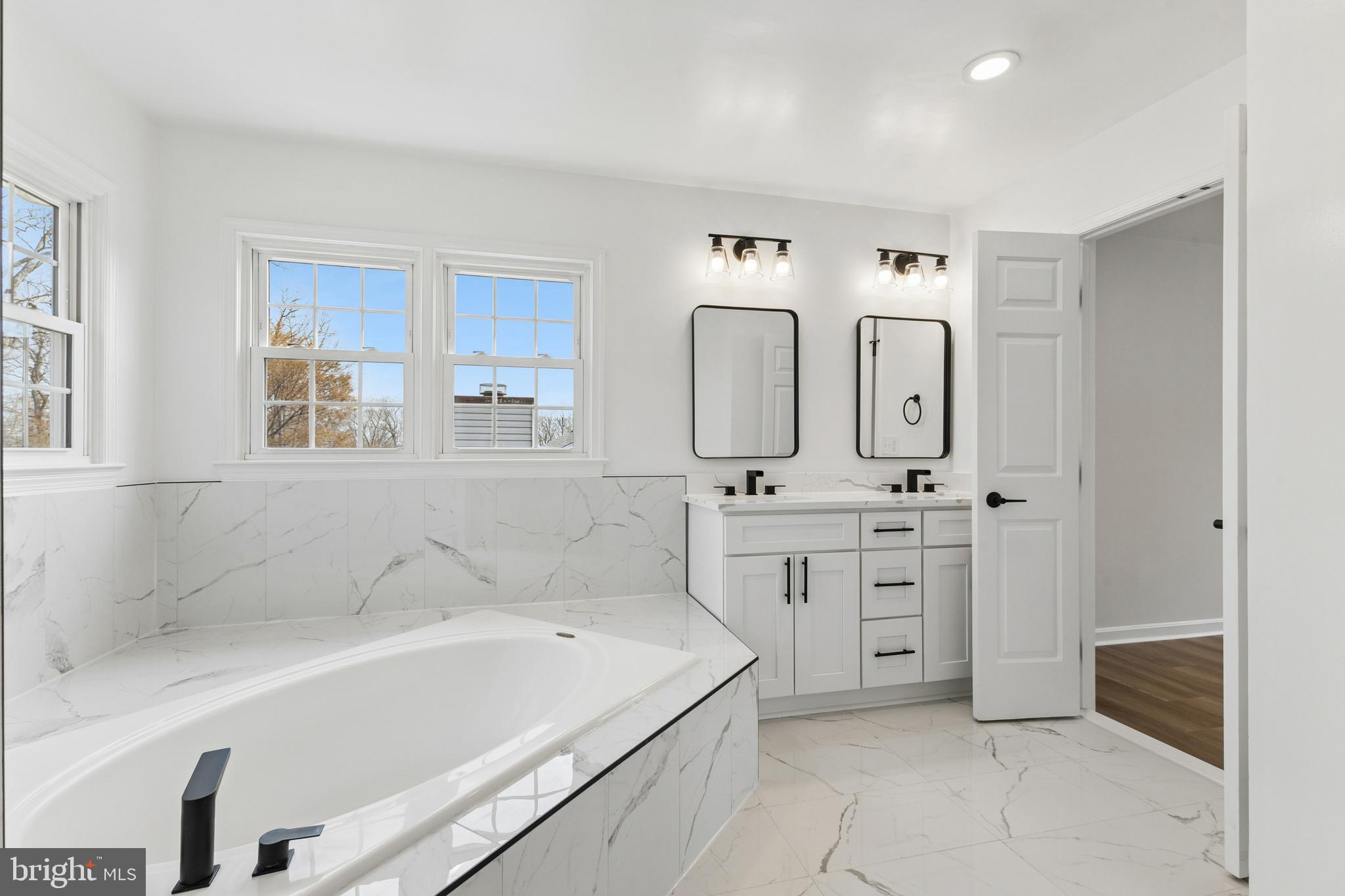 8 Lawhorn Road Stafford, VA 22554 - Photo 34 of 40 a spacious bathroom with a double vanity sink mirror and bathtub