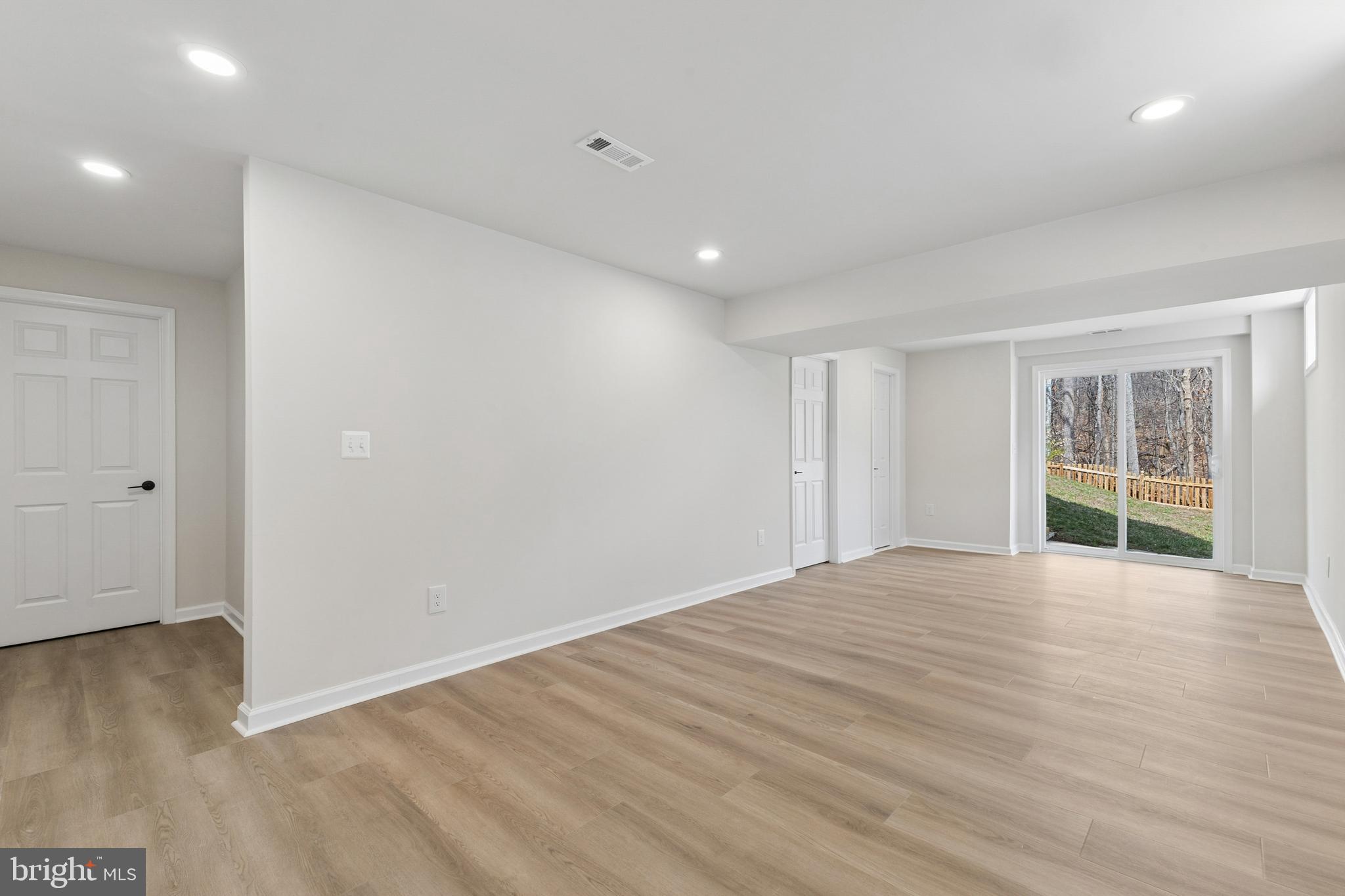 8 Lawhorn Road Stafford, VA 22554 - Photo 35 of 40 a view of an empty room with wooden floor and a window